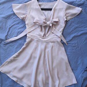 Elegant Cream Dress with Bow Detail